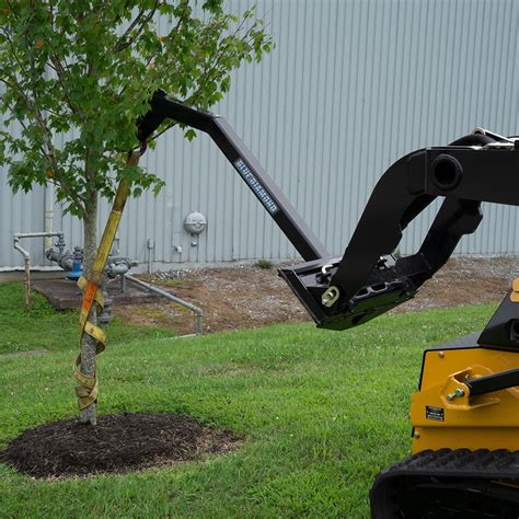 skid steer using tree boom|skid steer tree boom attachment.